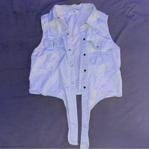 Light blue cropped jean shirt.